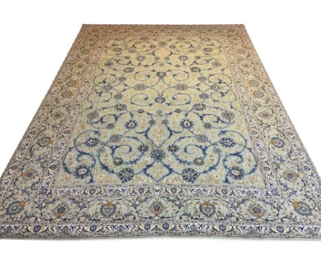 FINE KASHAN CARPET, 430cm x 310cm, all over palmette and scrolling vine design on a jade field within corresponding guard str