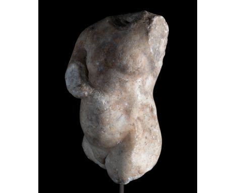 Torso of a child. Ancient Rome, ca. 3rd century AD.Marble.The right arm is damaged and has soil deposits.Provenance: Acquired