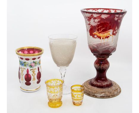 &nbsp;A 19th century Bohemian ruby flash etched chalice, with stags and deer in woodland, on a later wooden base; overlaid gl