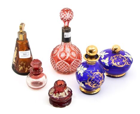 A cut glass ruby flash glass scent bottle and stopper; other scent bottles, pot and cover, atomiser (6)