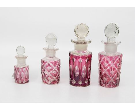 Four graduating ruby flash glass scent bottles