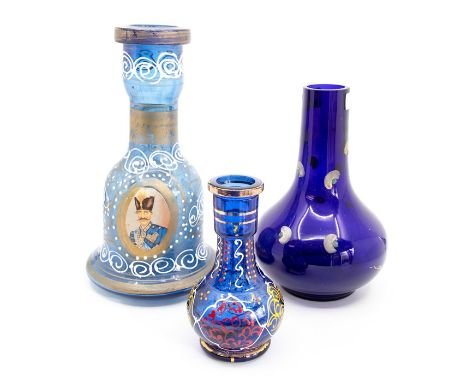 Three blue glass bottles, one painted with a portrait of a gentleman (3)