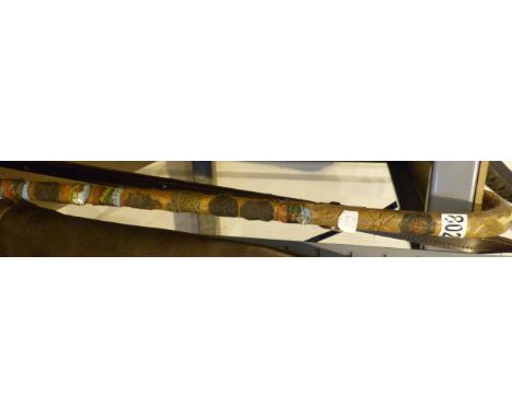 Souvenier walking stick with badges 