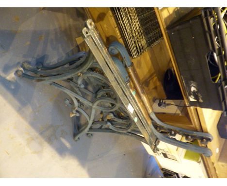 Pair of cast iron bench ends and a pair of table supports