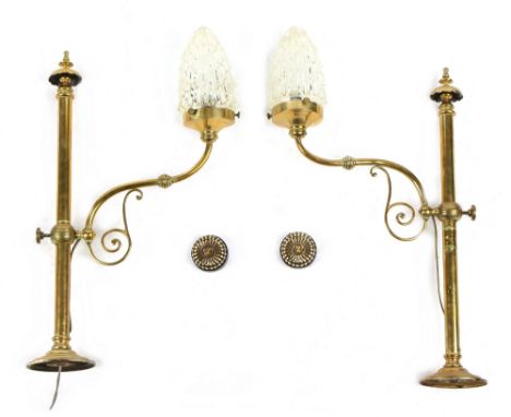 Property of a gentleman - a pair of early 20th century brass wall lights with clear glass shades, adapted to electricity, eac