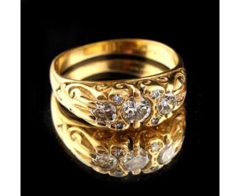 Property of a lady - a late 19th / early 20th century high carat yellow gold diamond ring, with three round brilliant cut dia