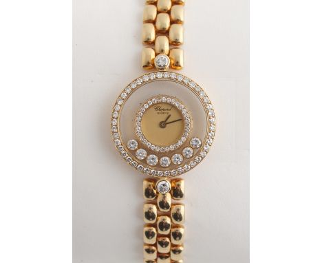 Property of a lady - a lady's Chopard 18ct yellow gold cased 'Happy Diamonds' wristwatch, in excellent condition, on 18ct yel
