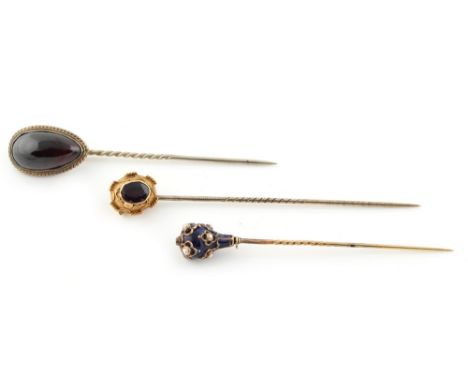 Property of a lady - a blue enamel &amp; seed pearl stickpin, possibly Russian; together with two garnet stickpins (3) (see i