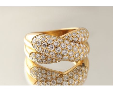 A Cartier 18ct yellow gold diamond crossover ring, circa 1992, signed Cartier &amp; numbered with other marks, approximately 