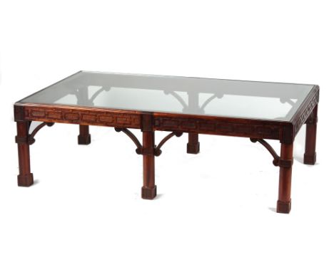 Property of a gentleman - a Chippendale style carved mahogany rectangular topped coffee table, with inset plate glass top, 52