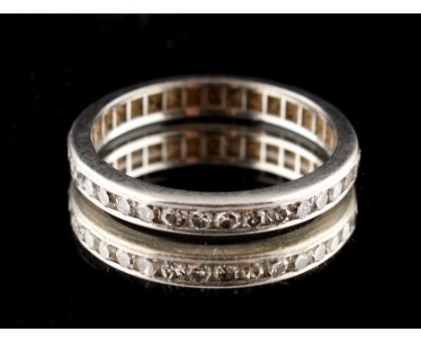 Property of a lady - an unmarked platinum or white gold diamond eternity ring, size J/K (see illustration). 