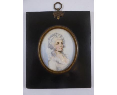 OVAL PORTRAIT MINIATURE ON IVORY DEPICTING A YOUNG WOMAN ON PERIOD COSTUME