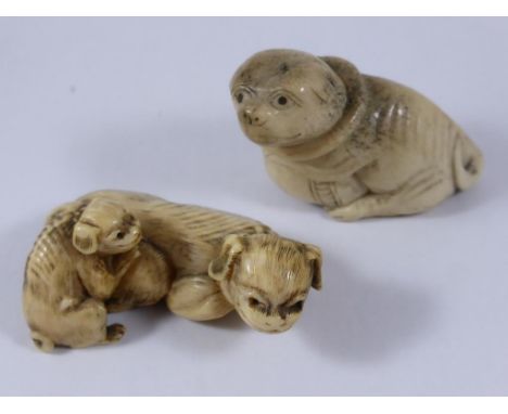 2 CARVED IVORY NETSUKE DEPICTING DOGS