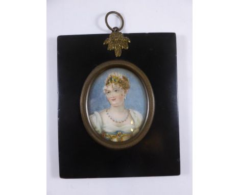 AN OVAL MINIATURE BUST PORTRAIT OF A LADY IN PERIOD COSTUME