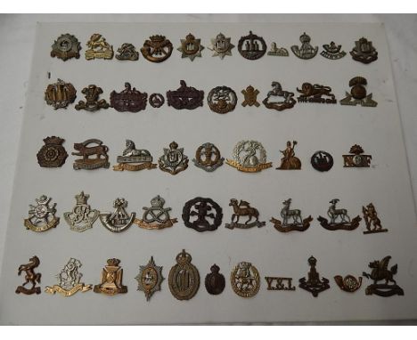 MILITARY INTEREST, MOUNTED COLLECTION OF APPROX. 50 MILITARY CAP & TUNIC BADGES INC. Y&L, QUEENS, R WARWICKSHIRE, NORFOLK, GL
