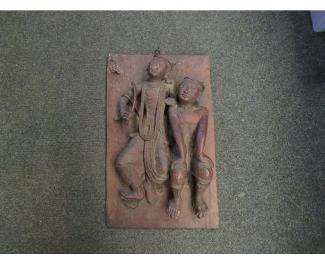 A carved Eastern hardwood panel depicting a male and female, a/f, 49cm x 30cm   