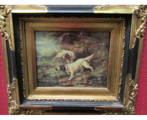An oleograph depicting two hunting dogs in ornate frame, 20cm x 24cm