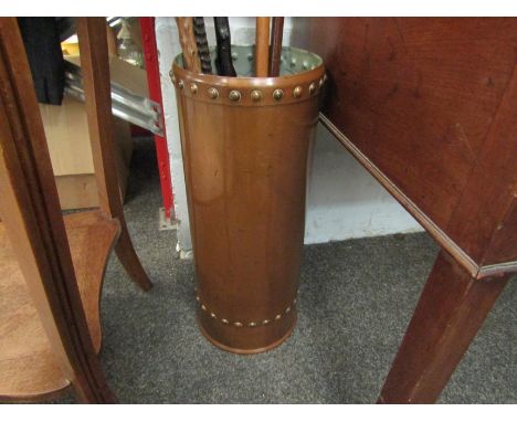 A copper stick stand with riveted edges, 45cm tall