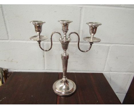 A silver plate three sconce candlestick with reeded column, 38cm tall