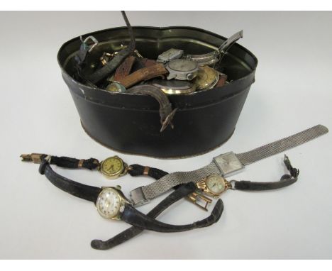 A tin containing a quantity of wristwatches and pocket watches including Cyma, Ingersoll, Rotary and 9ct gold cased example e
