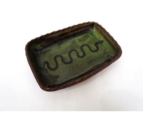 An early Winchcombe Pottery rectangular dish, waved 'snake' slip detail over green glaze. Impressed seal 25cm X 17.5cm  