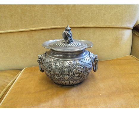 A Victorian twin handled pewter caddy/biscuit barrel with thistle and rose relief decoration, bust of Victoria knop