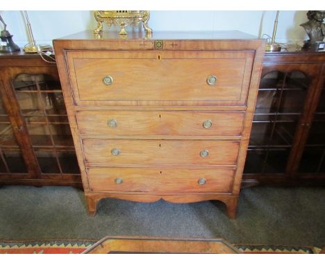 A George III crossbanded mahogany secretaire chest with inlaid decoration and brass central plaque over a drop front fitted s