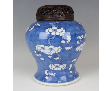 A Chinese blue and white porcelain jar, late Qing dynasty, of baluster form, painted with branches of blossoming prunus, unde