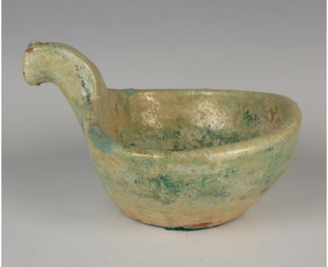 A Chinese green/silver glazed terracotta bowl/ladle, probably Han dynasty (206 BC - 220 AD), the bowl with short scroll handl