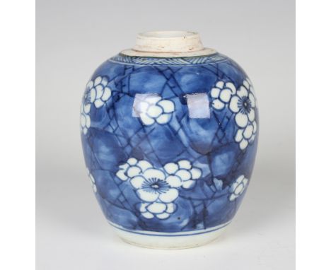 A Chinese blue and white porcelain tea caddy, Kangxi period, of ovoid form, painted with prunus on a 'cracked ice' ground, he