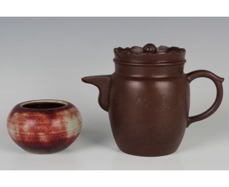 A Chinese Yixing stoneware teapot and cover, incised with bamboo branch and characters, height 12cm, together with a sang-de-