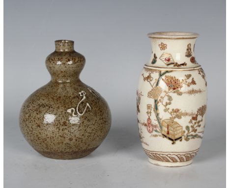 A Japanese Satsuma earthenware vase, Meiji period, the swollen cylindrical body thickly enamelled and gilt with a bird and fl