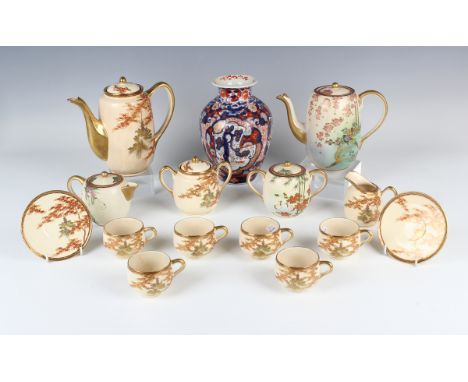 A Japanese Satsuma earthenware part coffee set, early 20th century, each piece painted and gilt with pagoda and acer branches