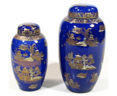 A 20thC graduated pair of Carltonware Bleu Royale Kang Hsi circular shouldered vases, each with compressed lids, 31cm high, e