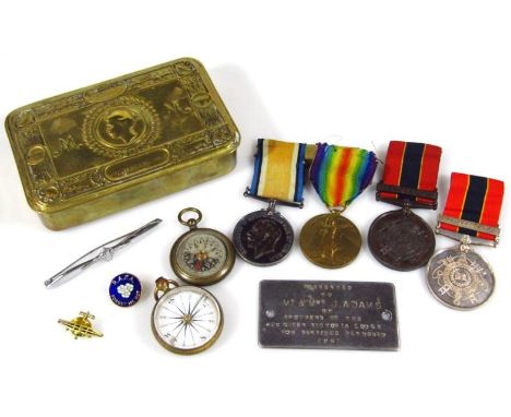 A Christmas 1914 WWI chocolate tin, 13cm wide, containing a quantity of medals, Campaign and Victory medal, similarly marked 