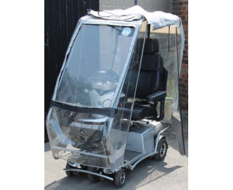 A Quingo Arc mobility scooter, with canopy top and other accessories, V5C certificate, registration AE60 AZO and two keys, 15