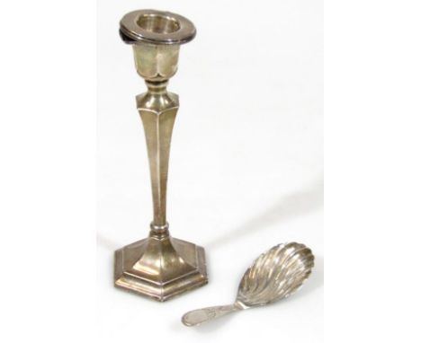 A George V silver candlestick, the urn dish holder on shaped stem and hexagonal foot, Birmingham 1921, 17cm high, and a Georg