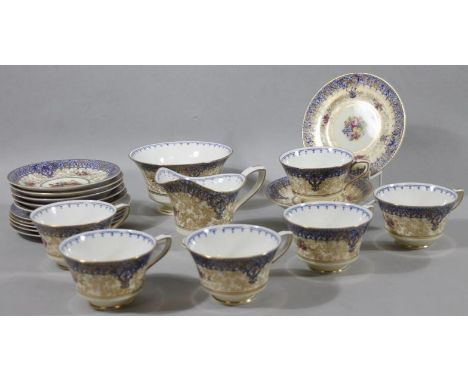 A Royal Worcester bone china part service, decorated and hand painted with flowers with gilt highlights, comprising milk jug,