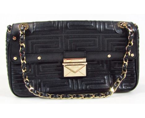 A Gianni Versace Couture black quilted patent leather shoulder bag, with gold tone chain link and leather strap, with push bu