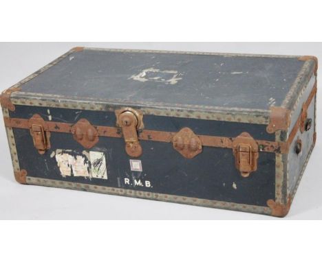 An early 20thC metal bound travel trunk, of rectangular outline with a fitted interior, 34cm high, 93cm wide, 52cm deep. (AF)