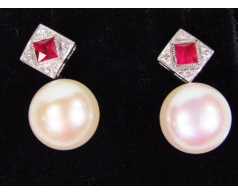 A pair of 18ct ruby diamond and pearl earrings, with diamond shaped tops, 1.5cm high.