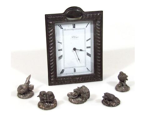 An R Carr mantel clock, with silver surround, 9cm wide Roman numeric dial and enclosed movement. (battery powered), and five 