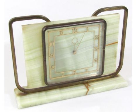 A 1930's Art Deco English mantel clock, in green polished marble and curved metal, with 15cm wide Arabic dial and hand wind m