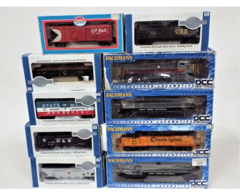 Four 00 gauge Bachmann DCC equipped diesel American locomotives and six boxed 00 gauge Bachmann American wagons 