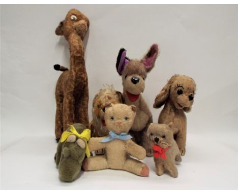 Seven soft toys, four by Merrythought, two dogs, lion and hippo