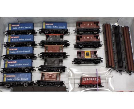 Collection of eighteen Hornby and Bachmann 00 gauge rolling stock, brake vans, bolster wagons and freight vans 