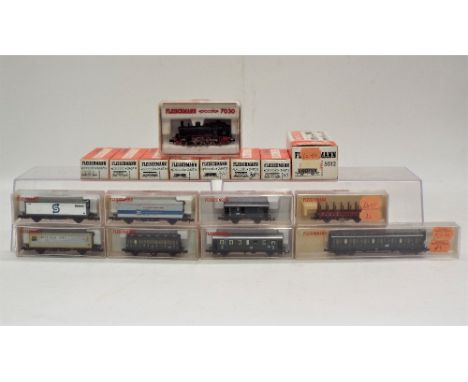 N gauge boxed Fleischmann 2-6-0 steam locomotive and sixteen coaches and goods wagons in original boxes 