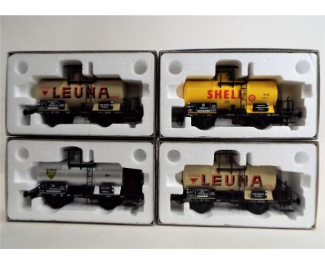 Four 0 gauge boxed scale model tankers