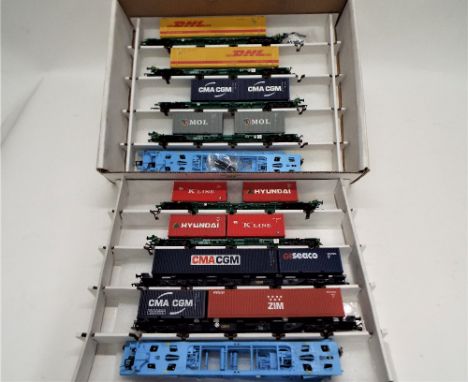 Twelve 00 gauge, Dapol and Bachmann Lowmac with containers 