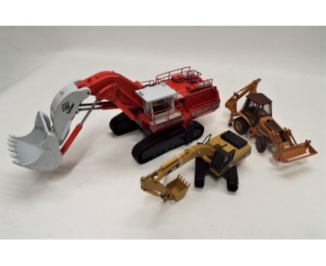 An NZG diecast excavator, a Conrad tractor and a Conrad RH120 C excavator 